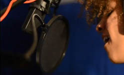 Singer in vocal booth
